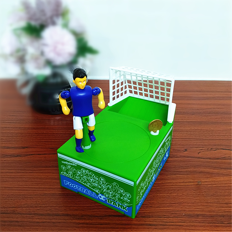 『ワールドカップ』サッカーシューティング 貯金箱｜サッカーボールの替わりにコインを置いてサッカー選手がゴールに向かってシュート